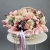 Композиция в корзине "Диодора" из французских роз Квиксенд, диантусов и кустовых пионовидных роз Бомбастик в Дмитрове